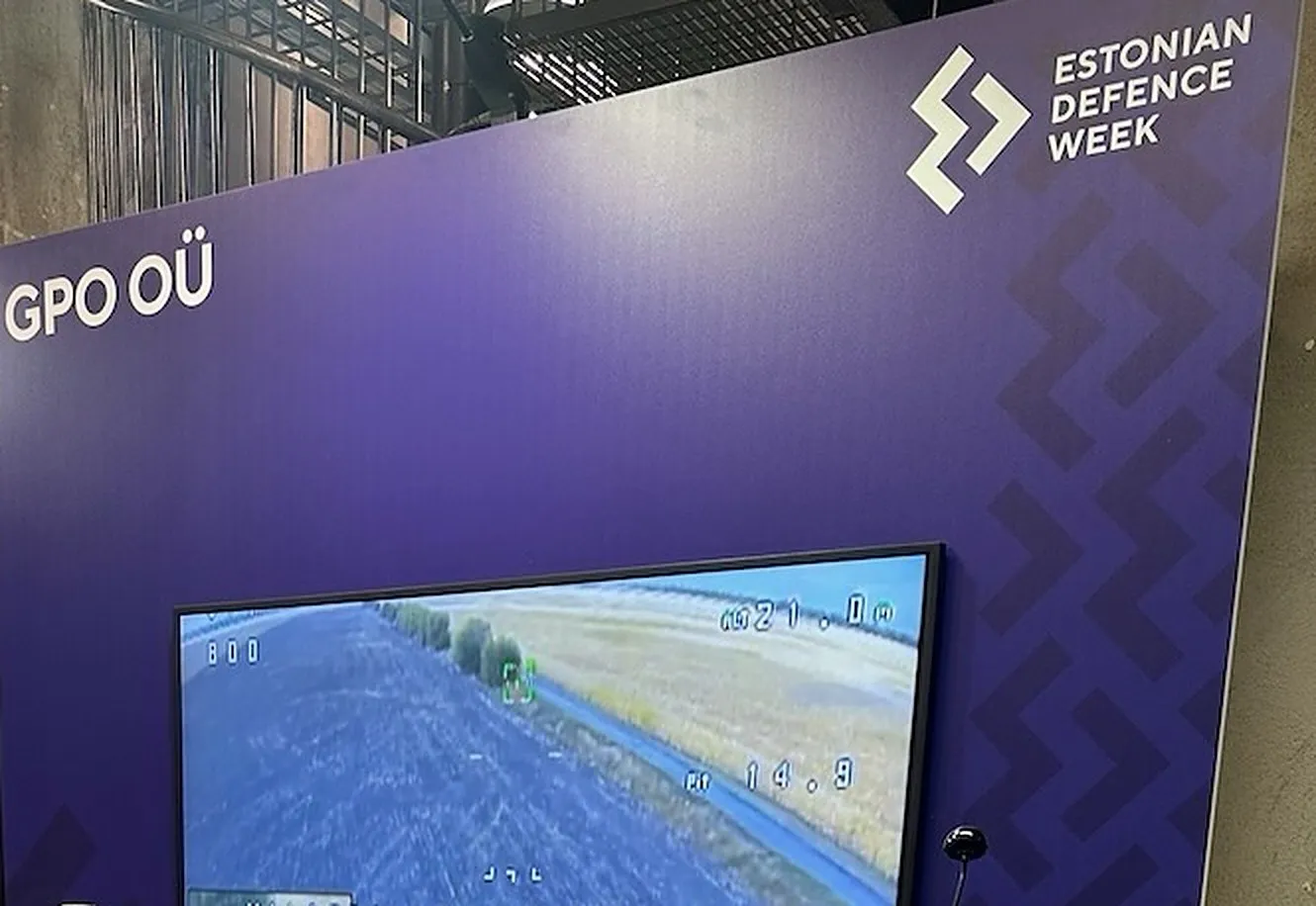 GPO OÜ stand at Estonian Defence Week 2026, with onboard drone camera footage on the screen
